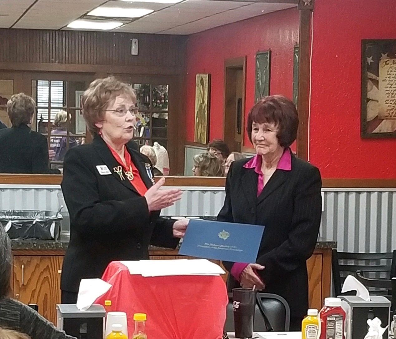 Cheryl Thomas of Holly Lake Ranch, right, receives her DAR Community Ser- vice Award.